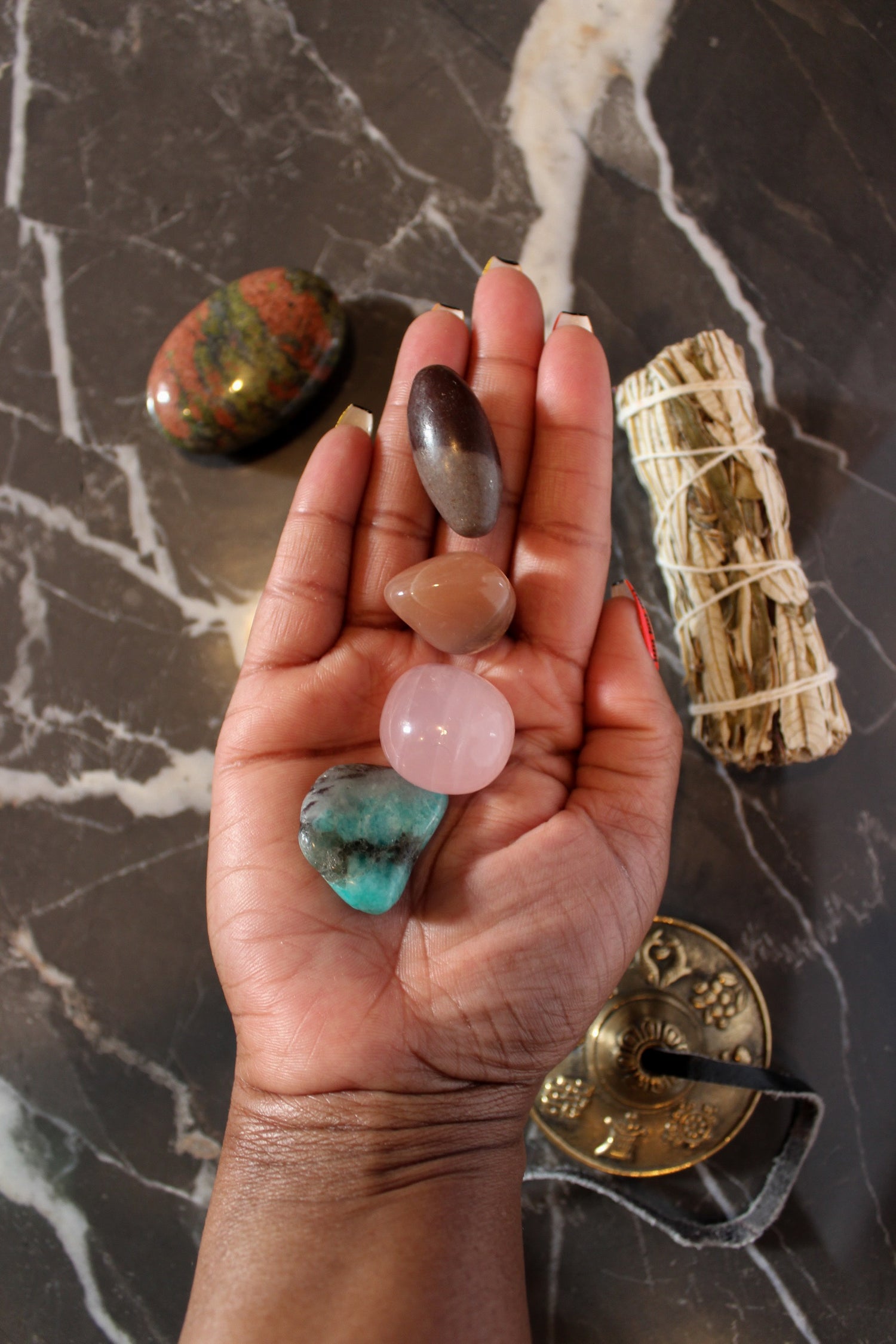 the Divine feminine crystal set | yerba santa smudge, rose quartz tumble, unakite palmstone, shiva lingam, peach moonstone, amazonite